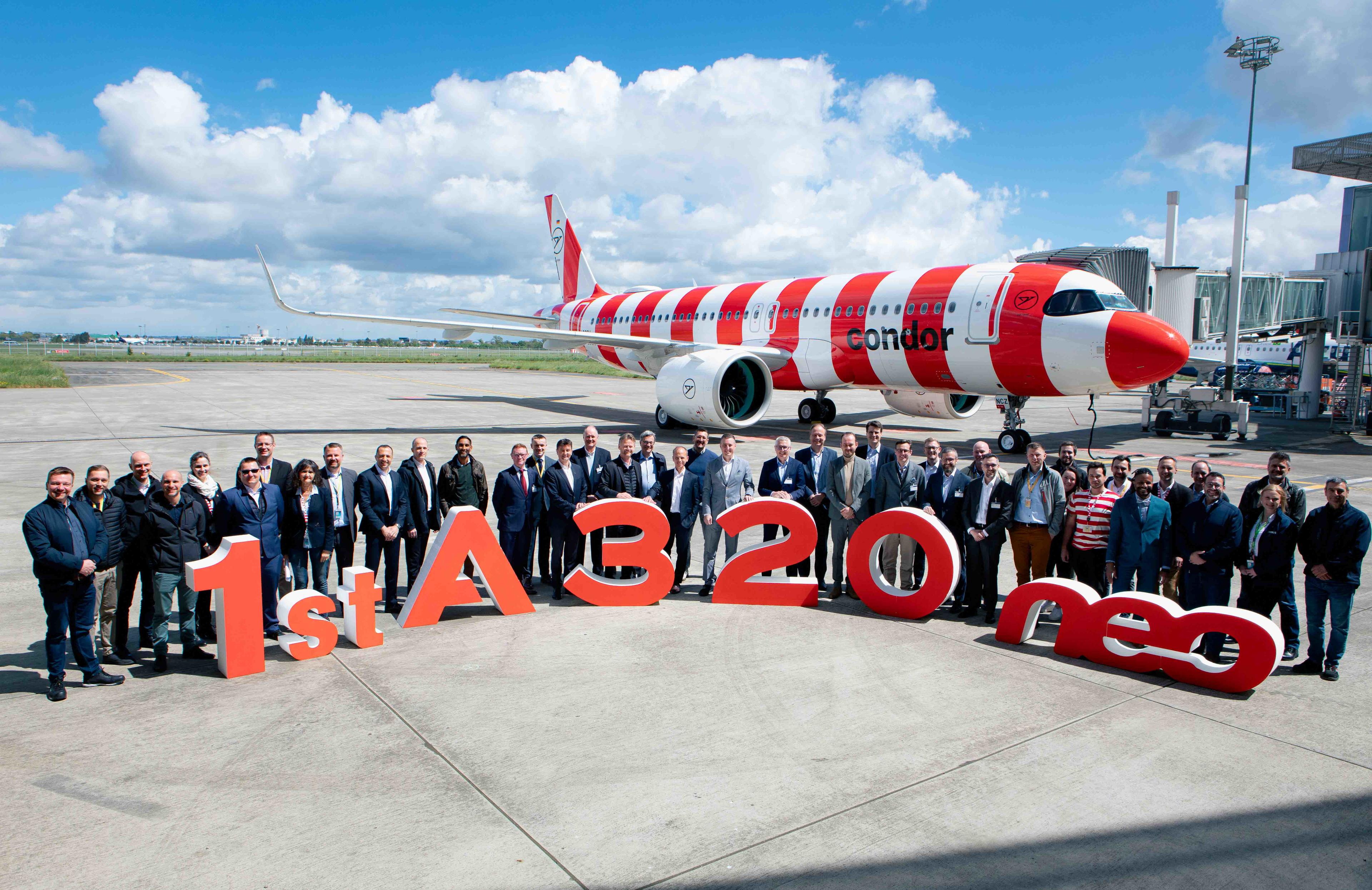 Red and white striped Condor Airbus A320neo at delivery in Toulouse